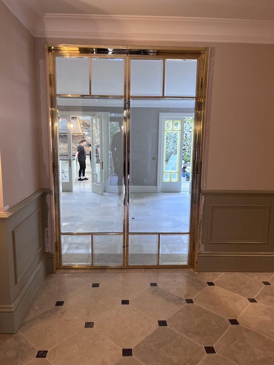 Finished brass doors in the hallway